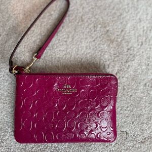 Coach cranberry wristlet. Corner zip